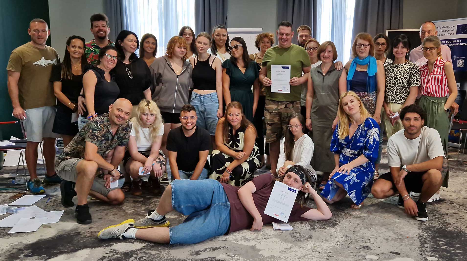 Group photo of TC participants facing the camera